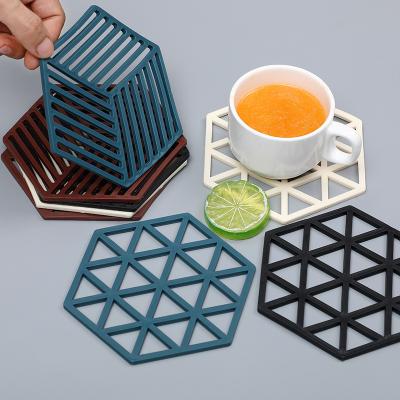 China Durable Waterproof Thermal Insulation Rubber Coaster Hexagon Cored-Out Silicone Coasters For Hot Drinks for sale