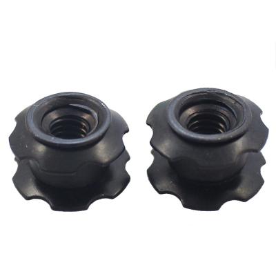 China Automotive Industry M8 X Black Steel Oxide 20 Flower Threaded Star Button Insert Nut for sale