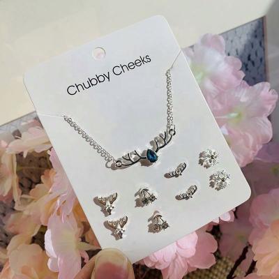 China TRENDY Silver Crystal Rhinestone Cross Heart Snowflake Flower Necklace Earrings 5 Pieces Set Paper Card Jewelry for sale