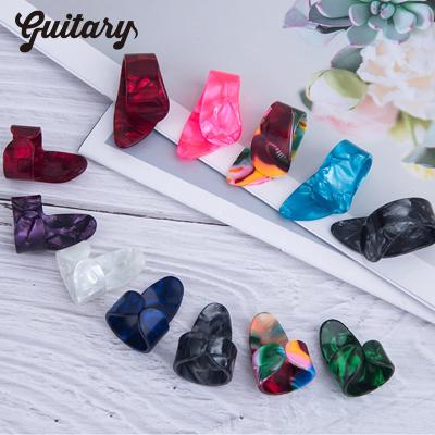 China Music Enlightenment Colorful Popular Well-designed Celluloid Finger Thumb Guitar Picks for sale