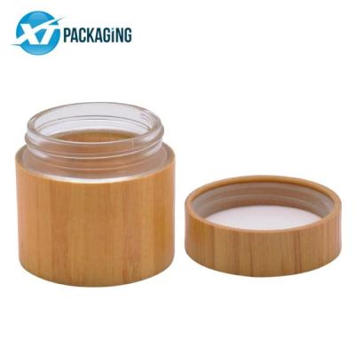 China Hot Sale Cosmetic Frosted White Black Amber Airtight Glass Storage Jars With Wooden Screw Lid Manufacturers for sale