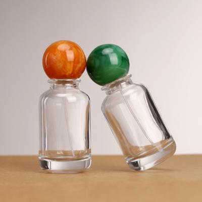 China Unique creative 30ml 50ml 100ml 100ml Round Empty Luxury Ball Cap Parfum Packaging Bottle Spray Atomizer Perfume Bottle for sale