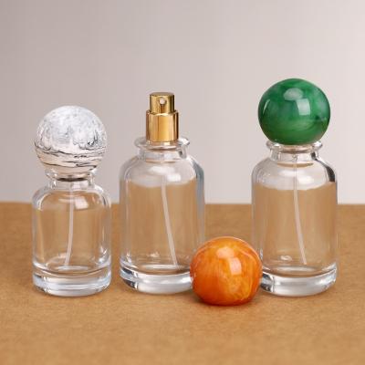 China Empty Round Transparent 30ml 50ml 100mlLluxury Glass Spray Perfume Bottle Crimp pump spray perfume glass bottle for sale
