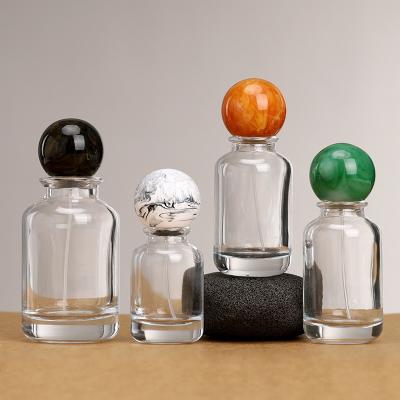 China Wholesale Round 30ml 50ml 100ml Clear Perfume Glass Bottle Empty Cosmetic Perfume Packing Glass Bottle With Ball Cap for sale