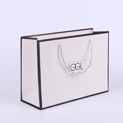 China Recycled Materials Wholesale Custom Printed Luxury Crafted Paper Gift Shopping White Kraft Paper Logo Bag With Handle for sale