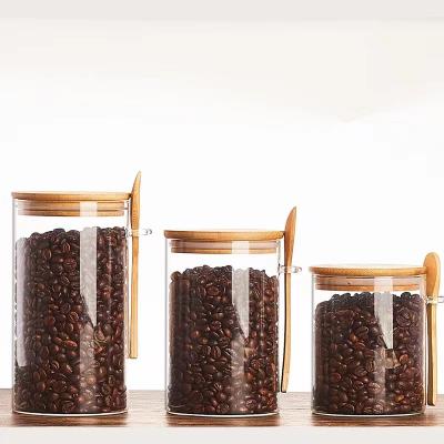 China Freshness Preservation YOLOWE HOME 750ml airtight glass jar with bamboo lid and spoon Glass food storage container oats container with lid for sale
