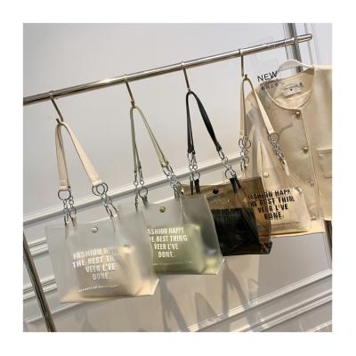 China Large Designer Ladies Jelly Casual PVC Transparent Shopping Shoulder Tote Bags Fashion Letters Pinch Clear Compound Purses and Handbags for sale