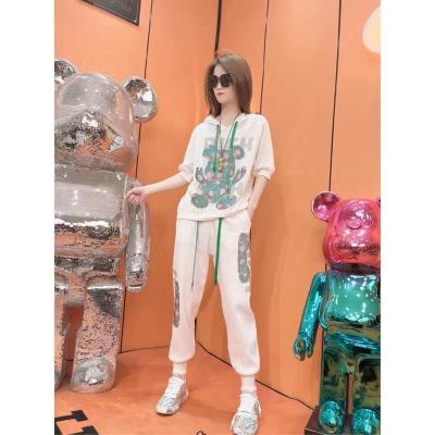 China Casual Matching Jogger Sports Print Bulk Suit Hoodie Female Clothing Tracksuits for sale