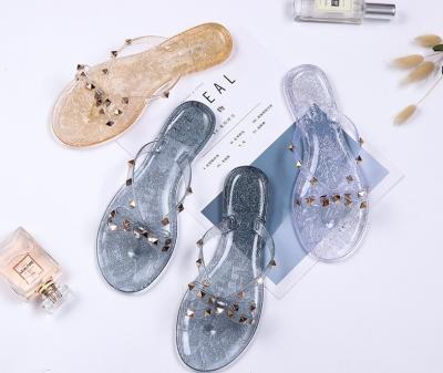 China Fashion Trend Rhinestone Rivet PVC Jelly Flat Bowknot Sandals Flip Flops Non Slip For Women Crystal Sandals Manufacturer for sale