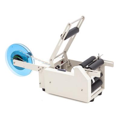 China Unique hot sale semi-automatic food design labeling machine for flat sticker for sale
