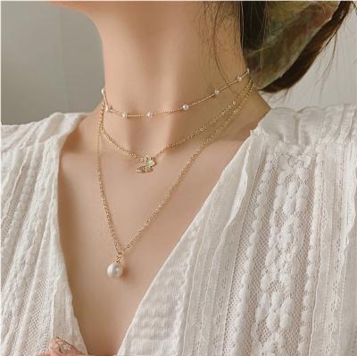 China XUNBEI 2020 New Fashion Double Layer Pearl Trendy Butterfly Women's Simple Necklace for sale