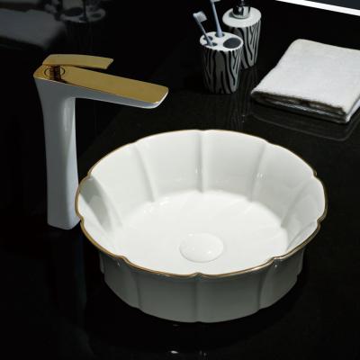 China Modern Hotel Flower Shape Luxury White With Line Art Gold Gold Basin Ware Table Top Ceramic Sanitary Sink Countertop for sale