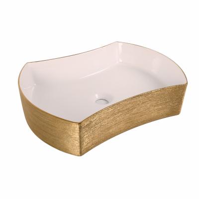 China Modern Luxury Golden Frosted Ceramic Bathroom Table Top Wash Basin for sale