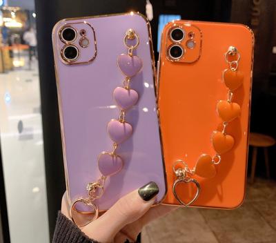 China Hot Shiny Girly Luxury Shockproof Color Phone Case With Love Heart Wrist Chain Strap For iPhone 12 pro 11 pro 11 phone case for sale