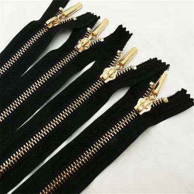 China Viable Popular Bulk Brass Reversible Custom Reversible Metal Jacket Metal Garment Zippers Garment Zipper Zippers for sale