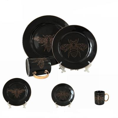 China Wholesale Disposable Luxury Melamine Dishes Set Stoneware Porcelain Gold Black Dinnerware With Gold Rim for sale