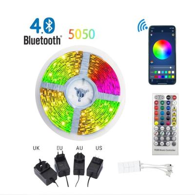 China Residential bright blue tooth app control music sync tiras de luz 65ft 5050 lux led rgb light strip for sale