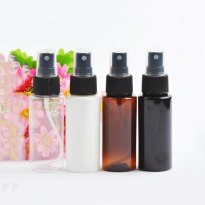 China Round Transparent Amber Cosmetic Cylinder Flat Shoulder 60ml PET Mist Spray Plastic Bottles In Stock for sale