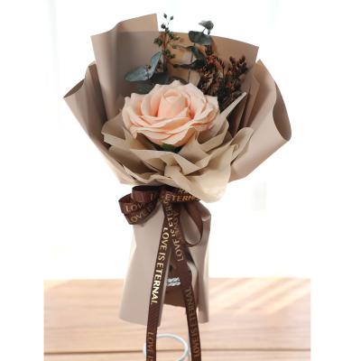 China Cheap Artificial Bridal Perfume Soap Flower Head Bouquet Paper Wrapping Rose Bouquet With Ribbon for sale