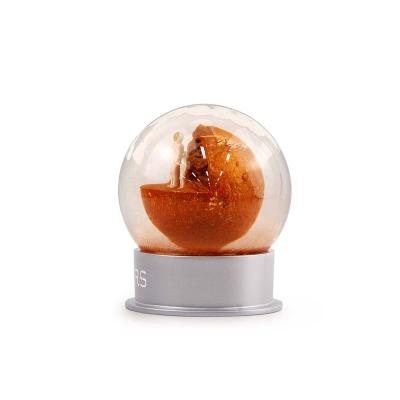 China Custom Luxury Snow Globe Europe Mars Planet Astronaut Creative Personality Resin Gift Snowball Souvenirs Ornament Snow Globe for sale