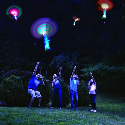 China Parachute UFO Night Party Toy HUAYI Sky UFO Night Party Outdoor Shooting Flying Bamboo Dragonfly With Light for sale