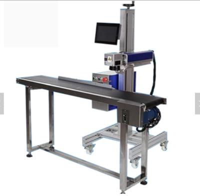 China High speed and prescion auto focus galvo scanner flying CO2 laser marking/cutting machine with conveyor for sale