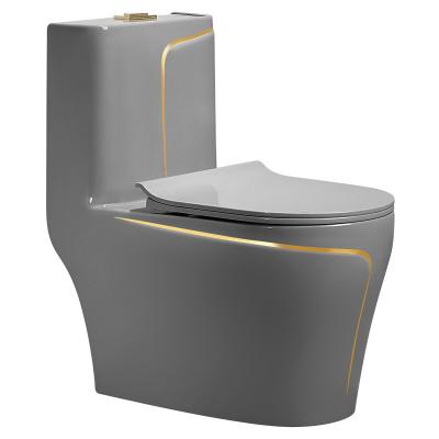 China Modern Hot Selling Double-Flow Home Bathroom Freestanding Toilet With Gold Patterned One-Piece Toilet With Soft Closed Lid for sale