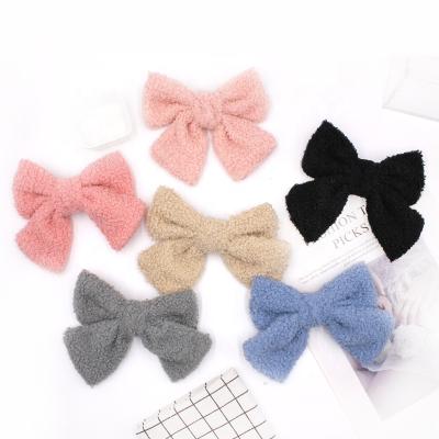 China Newest Pure Color Hair Pin Newest Pure Color Lambswool Hair Clip Bow Spring Clip For Women for sale