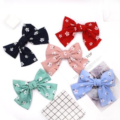 China Color Hair Pin Newest Customized Plum Blossom Printing Hair Clip Bow Spring Clip Large for sale