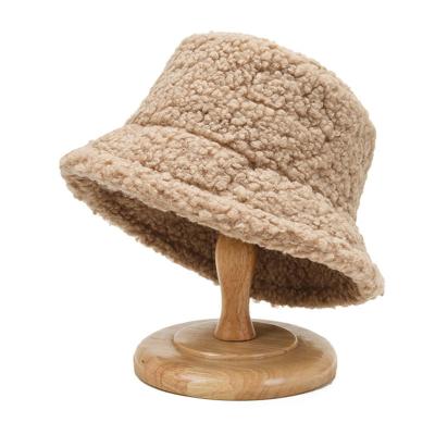 China Fashion COMMON Stocking Winter Bucket Hat Wholesale Lamb Wool Winter Fluffy Fur Bucket Hats For Women for sale