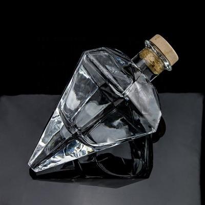 China Customized Logo Engraving Transparent Unique Design Shape Gin Glass Bottle With Cork for sale