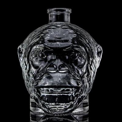 China Unique Design 500ml 750ml Monkey Head Shaped Glass Bottle for Vodka Liquor With Cork for sale