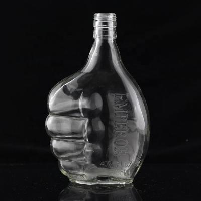 China Botella de vidrio industrial de 700 ml para la industria de bebidas en forma de pulgar en venta