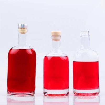 China Global Classic Round Shape 70cl 75cl Glass Bottle For Liquor With Customized Logo for sale