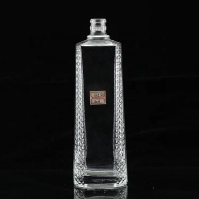 China Glass Body Carved Empty Liquor Bottle 500ml 750ml for High Grade Distilled Spirits for sale