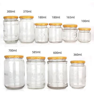 China 100ml 300ml 700ml Clear Honey Jam Food Glass Jar Bottles With Metal Lid zu verkaufen