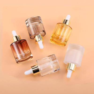 中国 白い帽子の厚さの基盤とのガラス シリンダー点滴器のびん15ml 30ml 40mlおよび50ml 販売のため