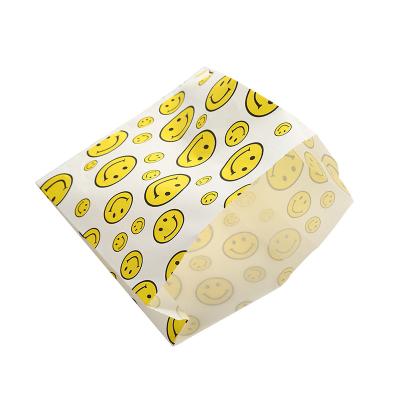 China Disposable Egg Oil Proof Bag Fried Chicken Food Wrapping Paper Bag Tart Smiling Face Paper Bag for sale