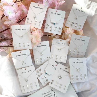 China High Quality Silver Crystal Rhinestone Cross Heart Snowflake Flower Necklace Earrings 5 ​​Pieces Set Paper Card Jewelry Set for sale