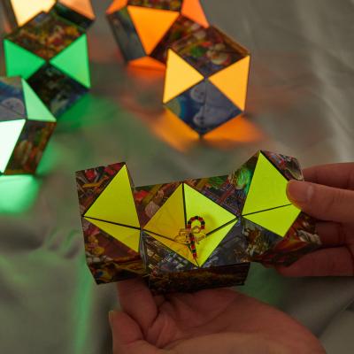 China Creative Christmas Jewelry Packaging Box Glow In The Magic Cube Flip Puzzle Toys Ring Packaging In Dark Infinity Boxes XMAS0026 for sale