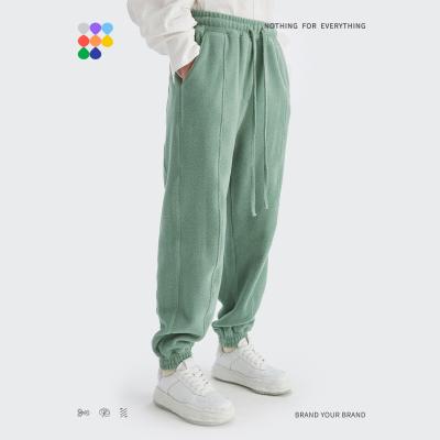 China 330g Logo Fleece Street Solid Color Track Pants Free Custom Heavy Ankle-Tied Anti-pilling Jogger Loose For Men for sale