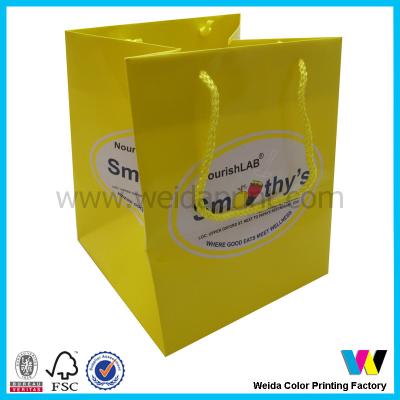 China Recycled Big Yellow Printed Paper Shopping Bags For Cupcake Packaging for sale