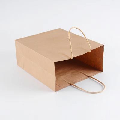 China Brown Shopping Takeaway Twisted Paper Bags 70gsm Bakery Food Grocery Food Shoes Wine Gifts Clothes Biodegradable Twisted Paper Bags for sale