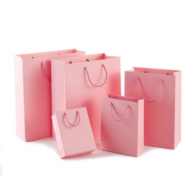 China Recyclable Custom Printed Logo Rose Craft Paper Bag Gift Decorative Handmade Paper Bags for sale