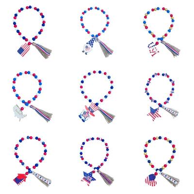 China Wooden Independence Day Wooden Bead Garlands with Tassels Farm Rustic 4th of July Flag Memorial Day Tray Tiered Garland Patriotic D for sale