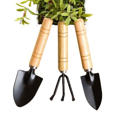 China Hot Sale Mini Small Walking Trench Digger Wheel Toy With Wood Handle Garden Pastoral Shovel Kit for sale