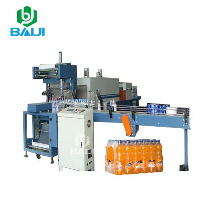 China automatic plastic beverage PE film heat shrink paper wrapping machine/shrink packing machine for PET water bottle for sale