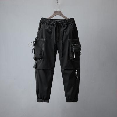 China OEM Wholesale Anti-Wrinkle Color Polyester Men's Cargo Loose Bottom 100% Narrow Pants With Side Pockets Pants for sale