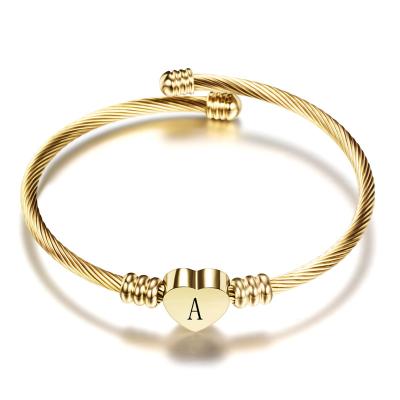 China Fashion Girls Gold Color Stainless Steel Romantic Heart Bangle Bracelet With Initial Letter Fashion Alphabet Charms Bracelets For Women for sale