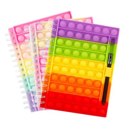 China Cheap Novelty A5 A6 Silicone Spiral Stress Relief Note Student Books Rainbow Bubble Busy Person Spiral Notebook Toys With Pen Tray for sale